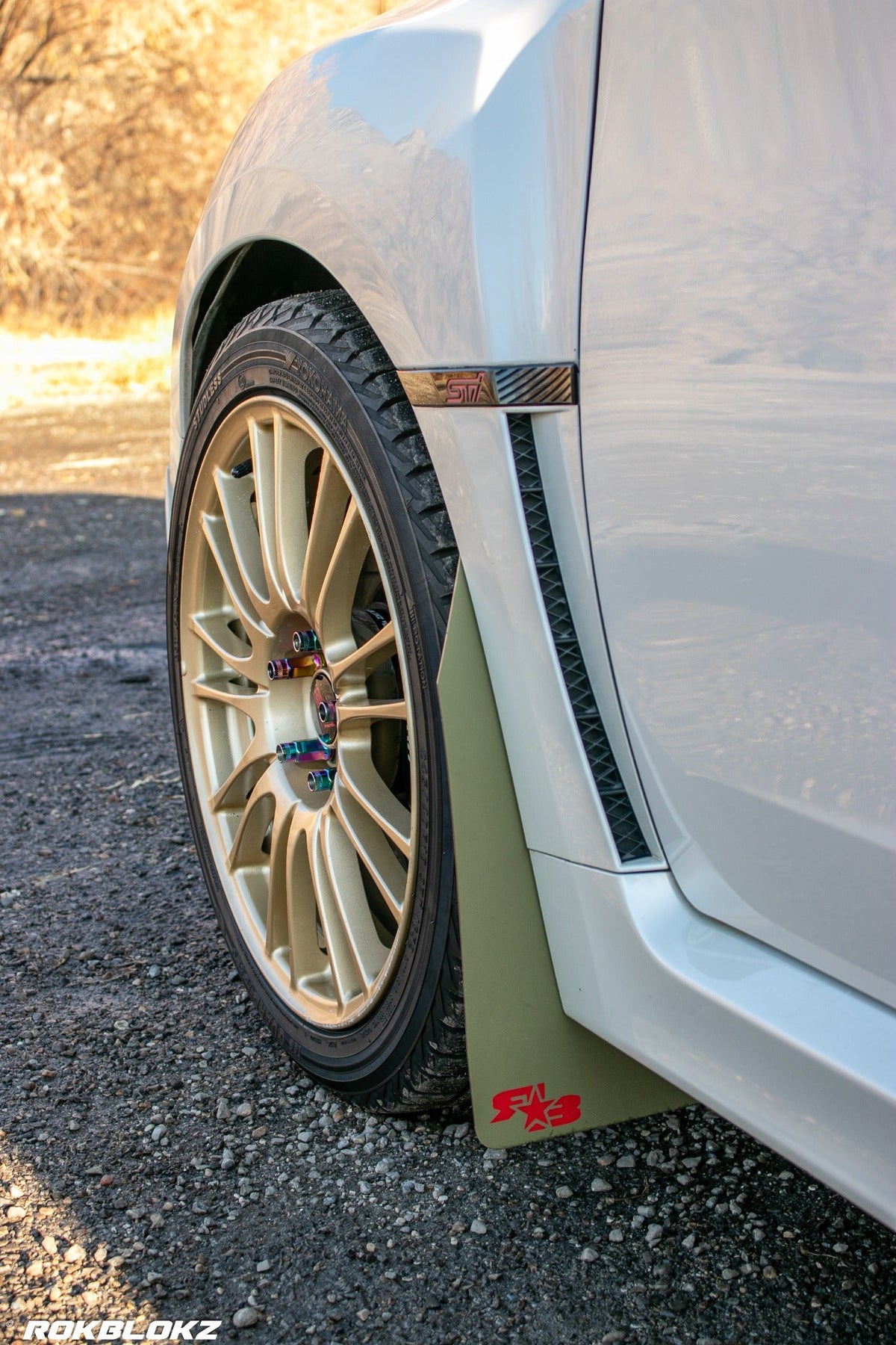 08-14 STI Hatch featuring Rokblokz Rally style Mud flaps in Olive Drab/red logo Original