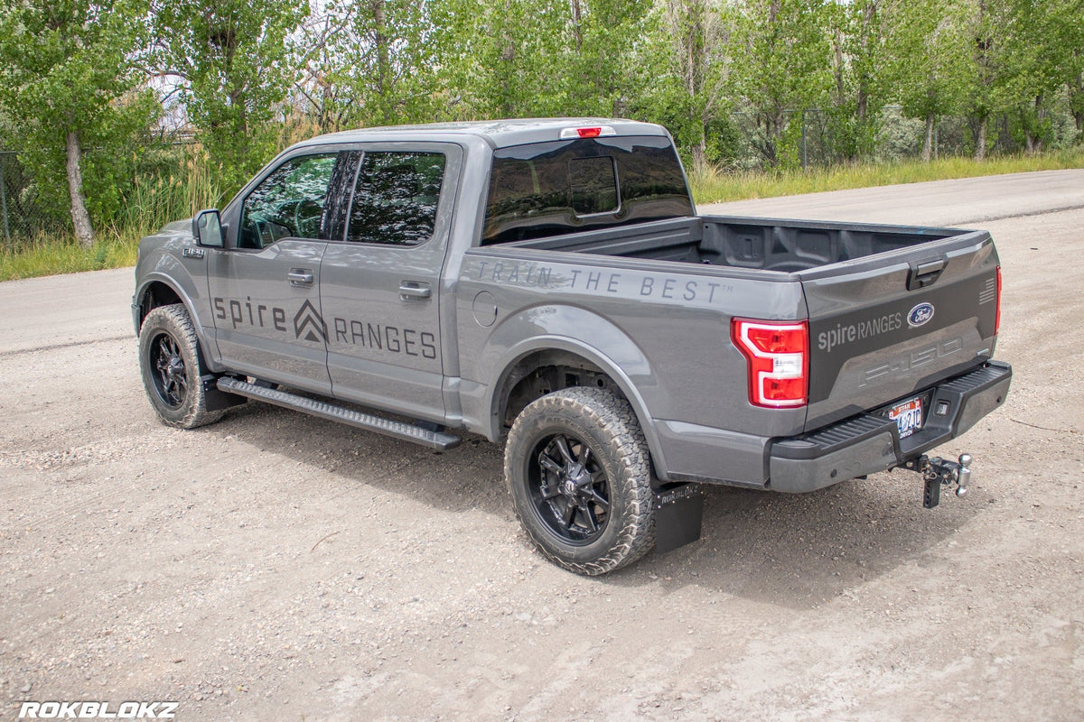 15-20 Ford F-150 Featuring Rokblokz Step Back Mud Flaps - driver rear 3/4