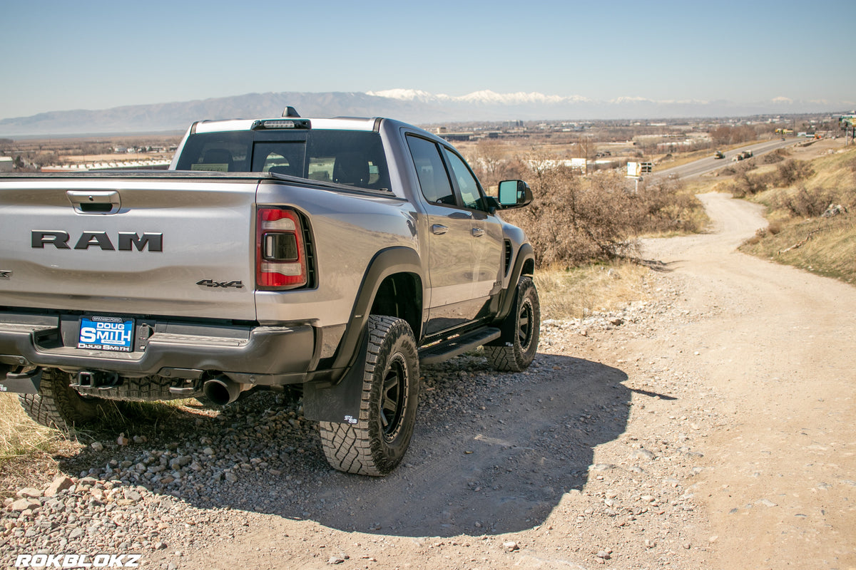 2021 Ram 1500 TRX featuring Rokblokz Mud Flaps Black w/ Grey Logo in Original size