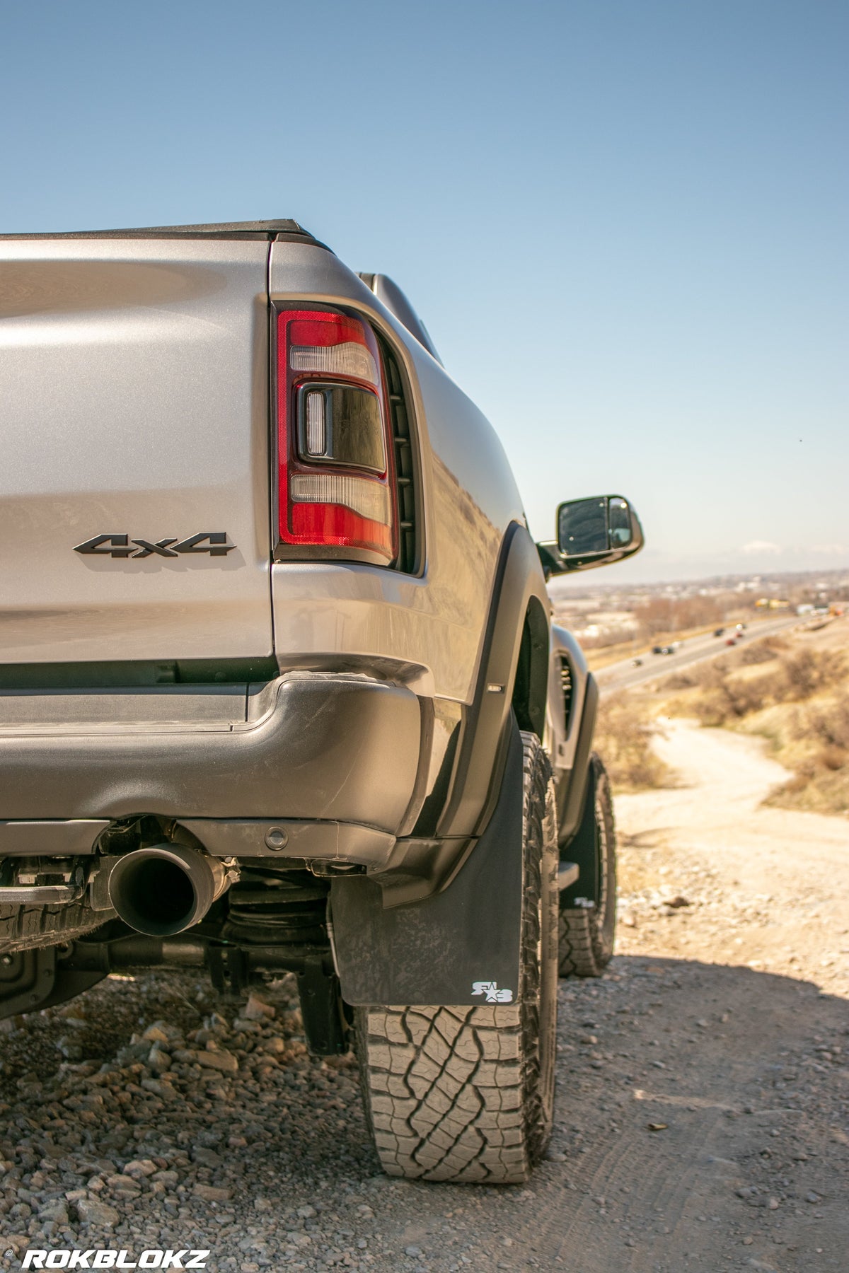 2021 Ram 1500 TRX featuring Rokblokz Mud Flaps Black w/ Grey Logo in Original size