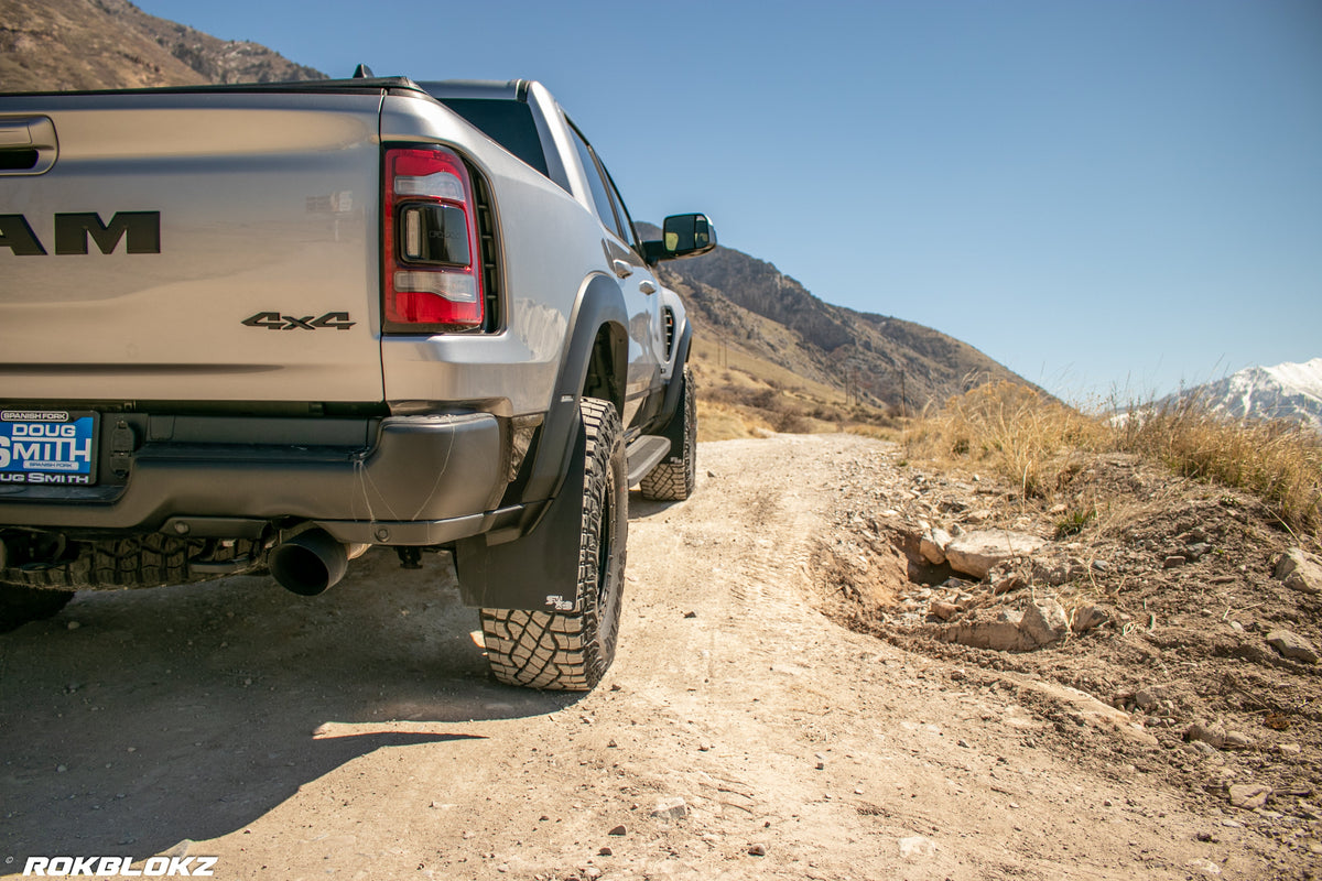 2021 Ram 1500 TRX featuring Rokblokz Mud Flaps Black w/ Grey Logo in Original size