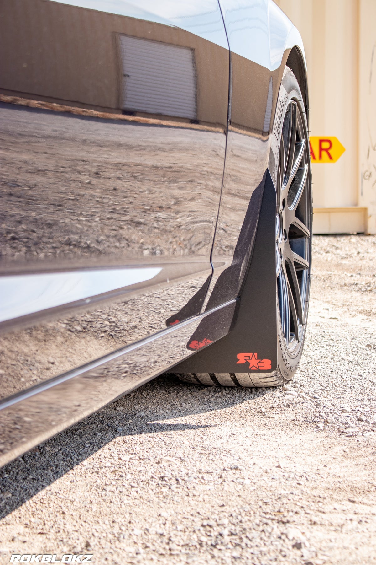 2016 Camaro featuring Rokblokz Rally Style Mud Flaps in Black w/ red logo